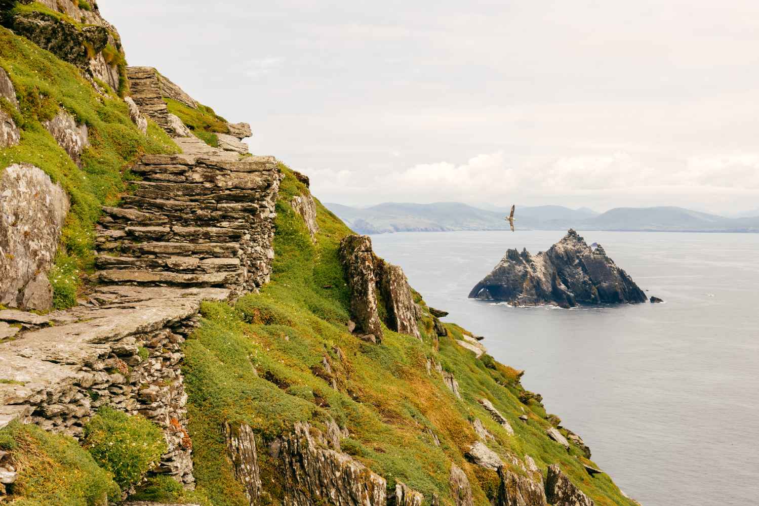 Visitors exploring the ancient stone steps of Skellig Michael Visitors exploring the ancient stone steps of Skellig Michael